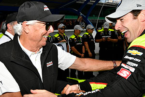 Rick Mears congratulates Simon Pagenaud on winning another pole for Team Penske